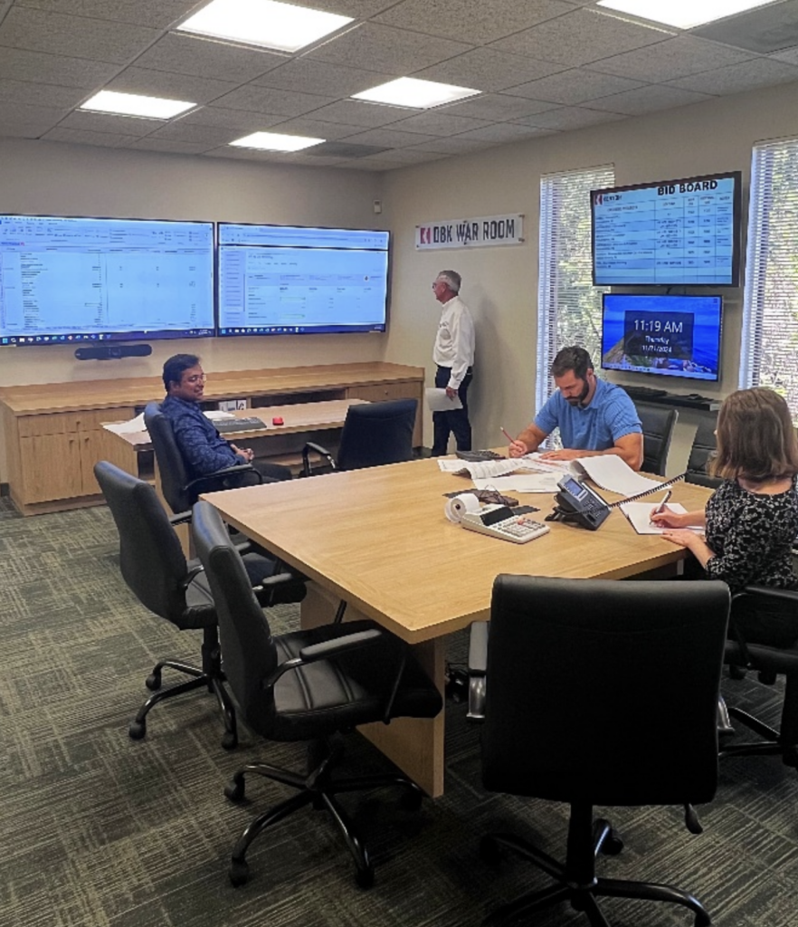 Four DBK employees in the office dedicated to projects and bibs, dubbed the "War Room."